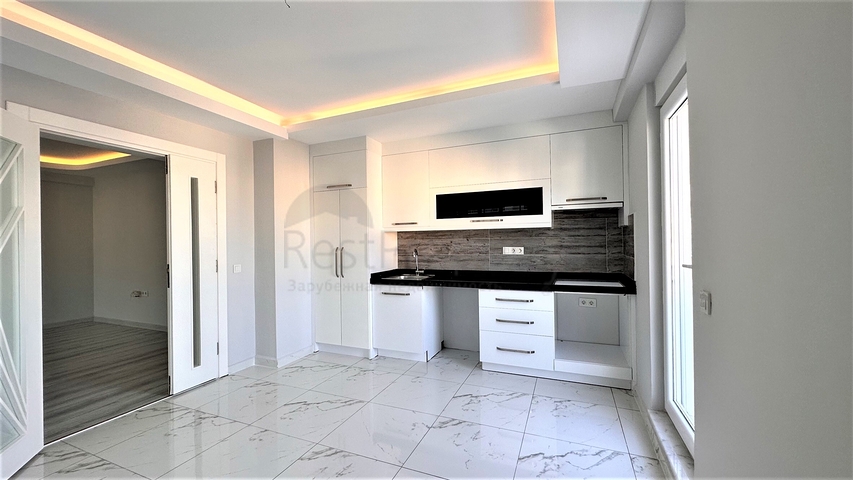 Пентхаус 2+1 в центре Махмутлара с видом на горы 