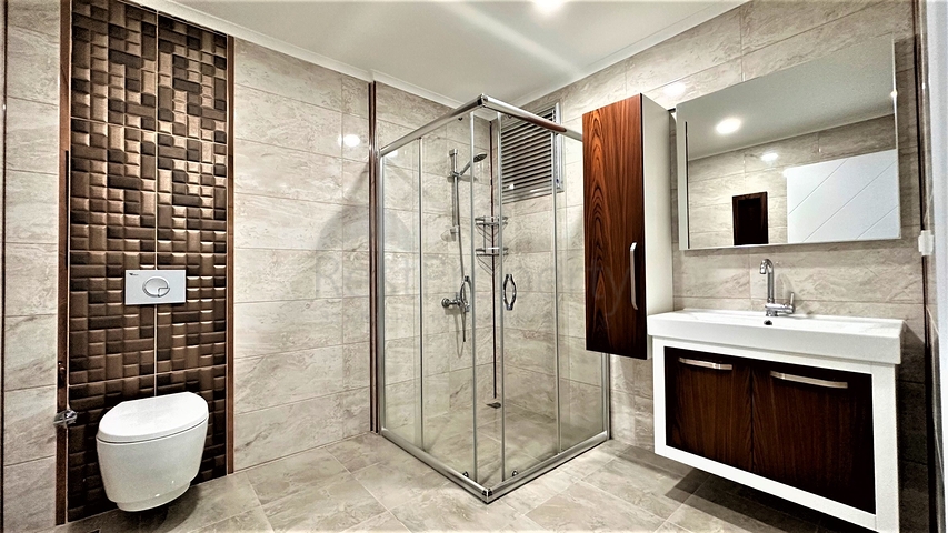 Пентхаус 2+1 в центре Махмутлара с видом на горы 