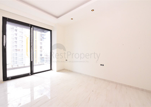 Квартира 1+1 на первой береговой линии в Махмутларе