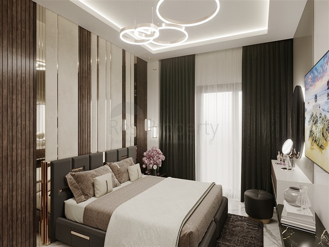 Квартира планировкой 1+1 в строящемся доме района Махмутлар