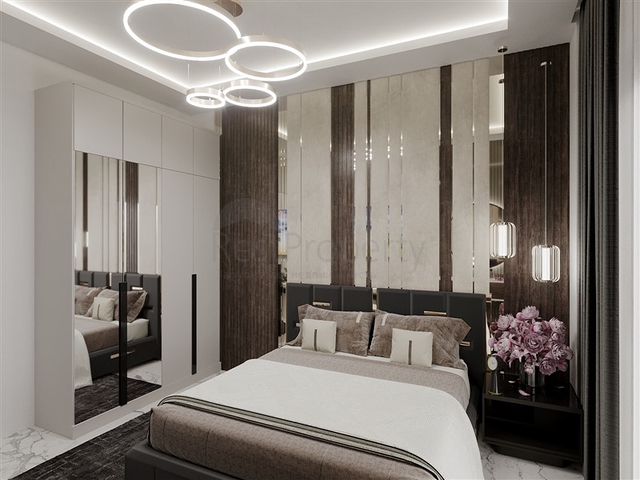 Квартира планировкой 1+1 в строящемся доме района Махмутлар