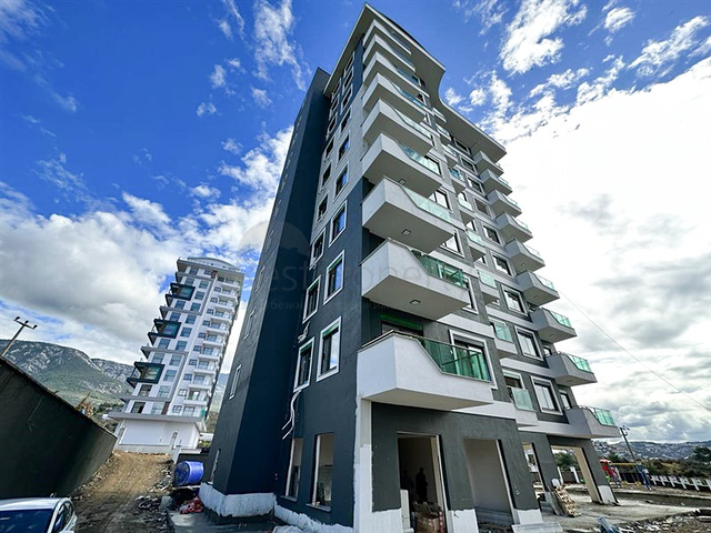 Квартира планировкой 1+1 в строящемся доме в районе Махмутлар