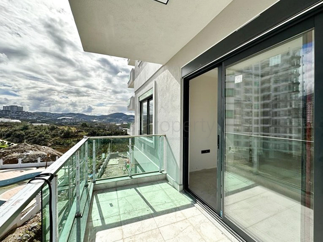 Квартира планировкой 1+1 в строящемся доме в районе Махмутлар