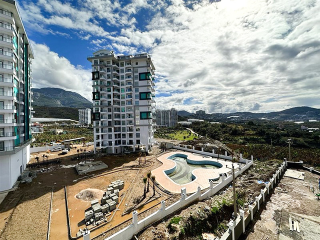 Квартира планировкой 1+1 в строящемся доме в районе Махмутлар