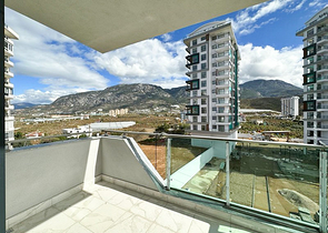 Квартира планировкой 1+1 в строящемся доме в районе Махмутлар