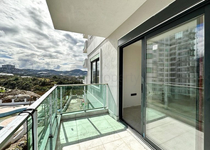 Квартира планировкой 1+1 в строящемся доме в районе Махмутлар