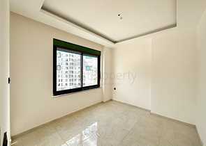 Квартира планировкой 1+1 в строящемся доме в районе Махмутлар