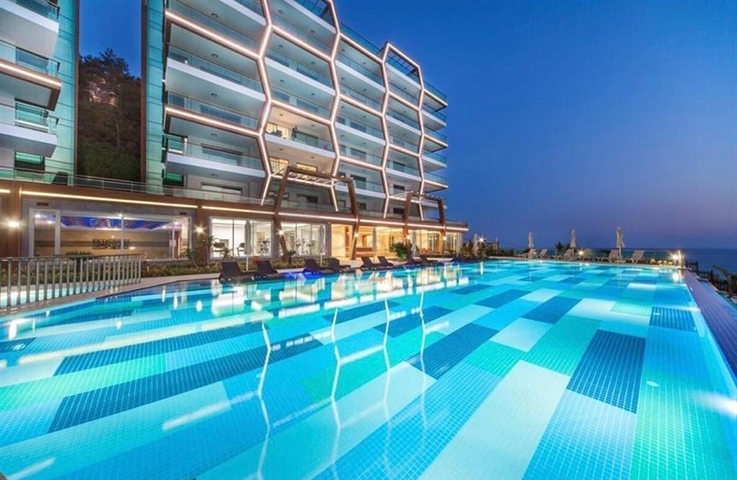 Меблированная квартира 1+1 с красивым видом на море в районе Каргыджак