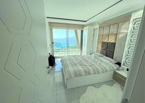 Меблированная квартира 1+1 с красивым видом на море в районе Каргыджак