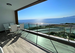 Меблированная квартира 1+1 с красивым видом на море в районе Каргыджак