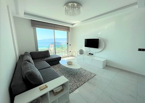 Меблированная квартира 1+1 с красивым видом на море в районе Каргыджак