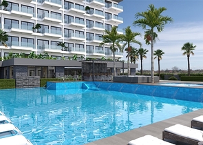 Квартира планировкой 1+1 в новом строящимся современном комплексе в Махмутлар