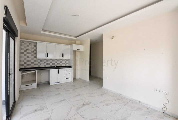 Квартира 1+1 в новом комплексе без инфраструктуры в районе Махмутлар