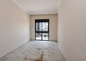 Квартира 1+1 в новом комплексе без инфраструктуры в районе Махмутлар