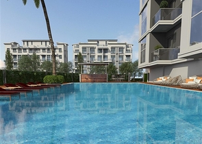 Просторная квартира планировкой 1+1 в строящемся доме в районе Махмутлар