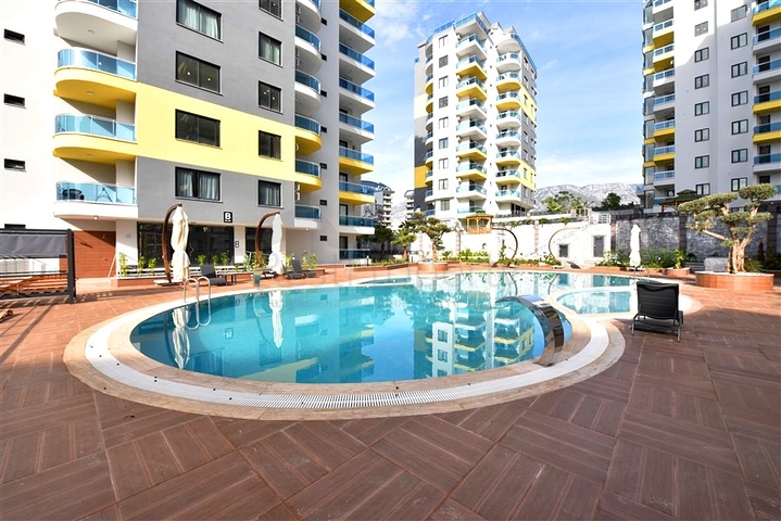 Квартира планировкой 1+1 в районе Махмутлар