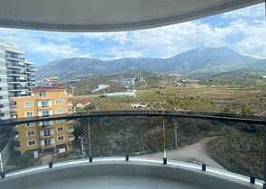 Просторные апартаменты 1+1 в районе Махмутлар