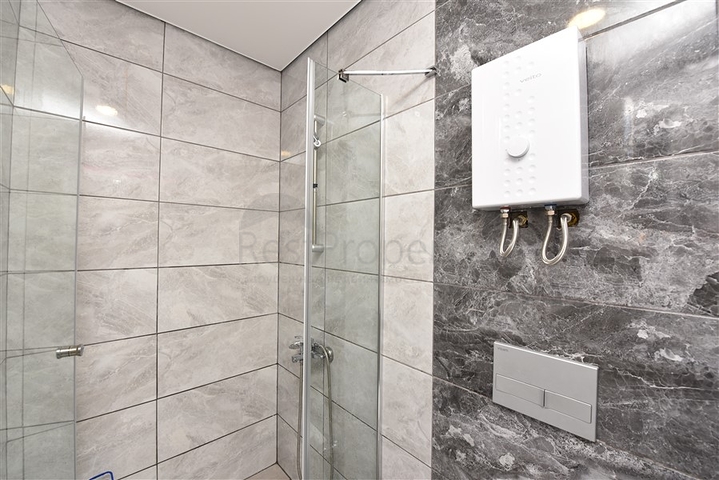 Меблированная квартира 1+1 с видом на море и на горы в районе Махмутлар