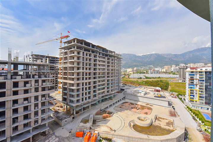 Уютная квартира 1+1 в популярном жилом комплексе в районе Махмутлар