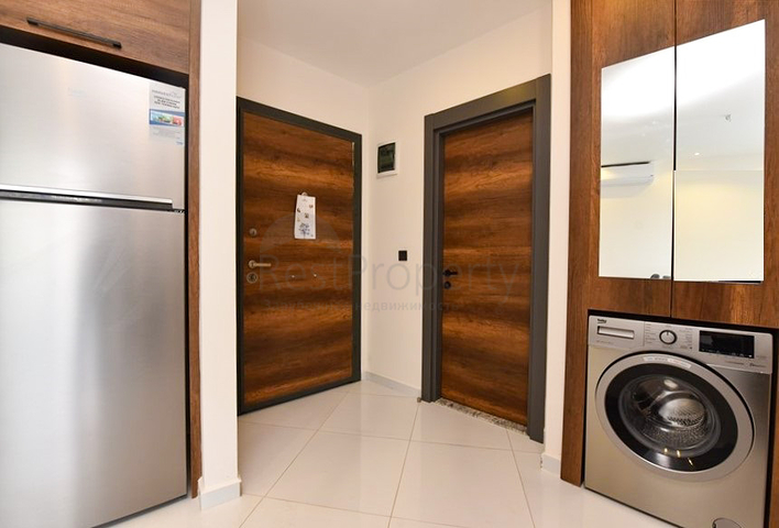 Уютная квартира 1+1 в популярном жилом комплексе в районе Махмутлар