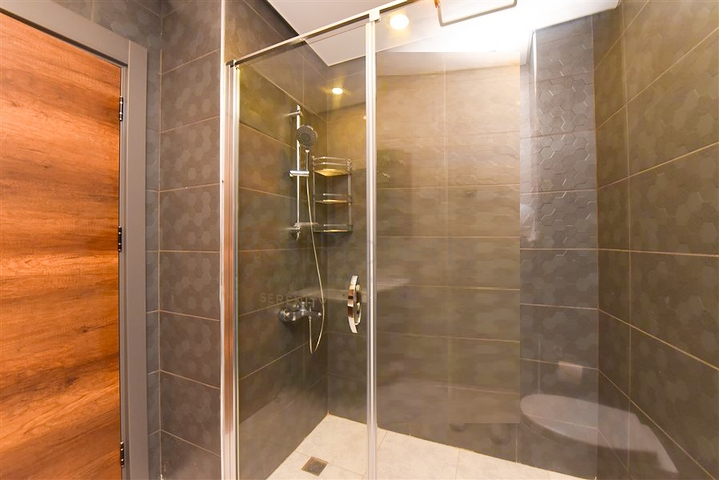 Апартаменты 1+1 в комплексе с отельной инфраструктурой в районе Махмутлар