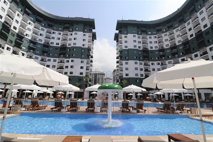 Апартаменты 1+1 в комплексе с отельной инфраструктурой в районе Махмутлар