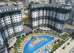 Апартаменты 1+1 в комплексе с отельной инфраструктурой в районе Махмутлар