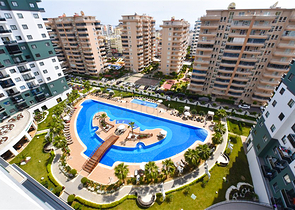 Апартаменты 1+1 в комплексе с отельной инфраструктурой в районе Махмутлар