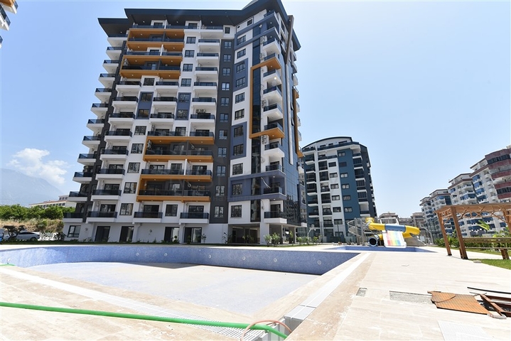 Квартиры 1+1 в новом комплексе отельной концепции в районе Махмутлар