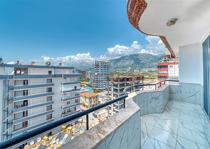 Просторная квартира в районе Махмутлар с видом на море и горы