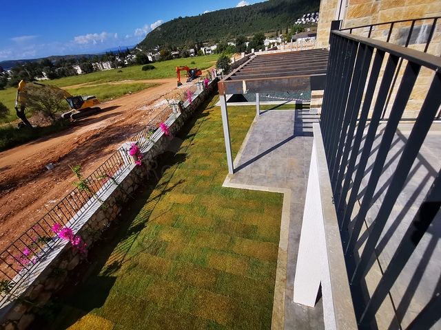 Виллы в живописном районе Туркбюкю, в окружение густой зелени. 