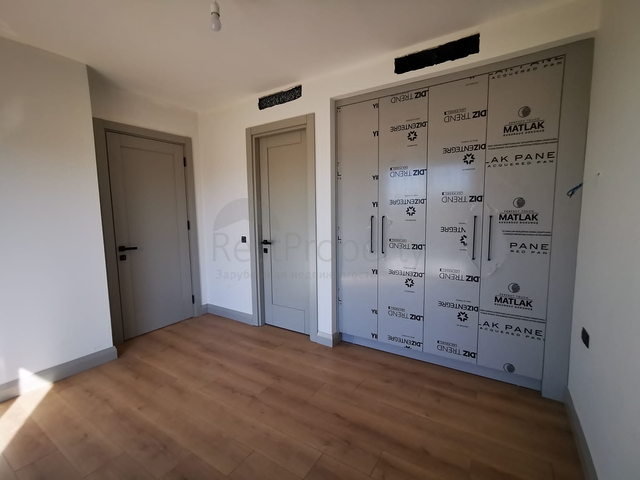 Виллы в живописном районе Туркбюкю, в окружение густой зелени. 