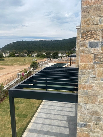 Виллы в живописном районе Туркбюкю, в окружение густой зелени. 