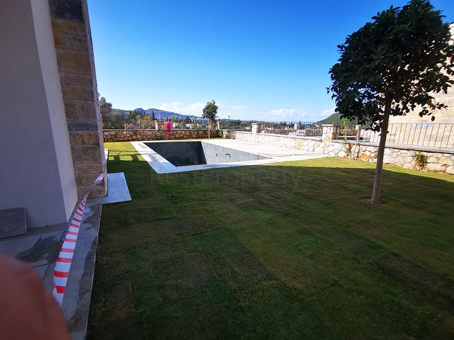 Виллы в живописном районе Туркбюкю, в окружение густой зелени. 