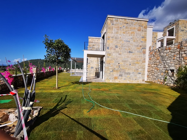 Виллы в живописном районе Туркбюкю, в окружение густой зелени. 