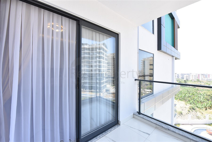 Светлая и уютная квартира 1+1 в районе Махмутлар