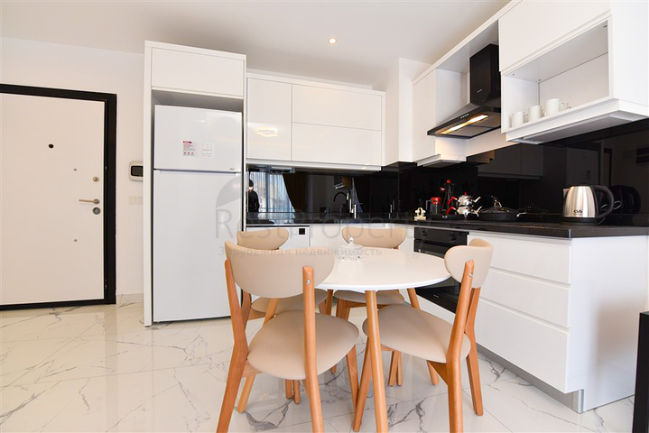 Светлая и уютная квартира 1+1 в районе Махмутлар