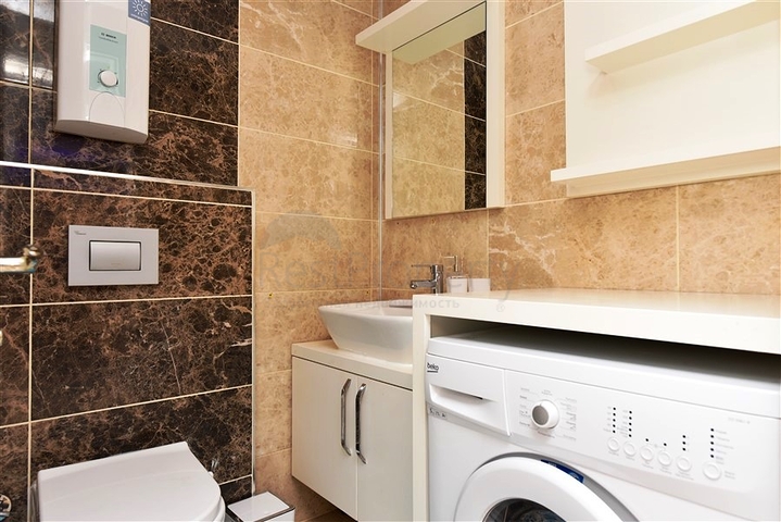 Квартира 1+1 в районе Махмутлар на расстоянии всего 350 метров до моря 