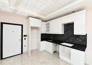 Квартира 1+1 с превосходной инфраструктурой в районе Махмутлар