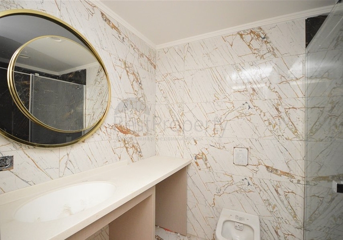 Квартира 1+1 в комплексе премиум класса на первой береговой линии в Махмутларе