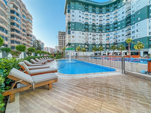 Меблированная квартира планировкой 2+1 в популярном районе Махмутлар