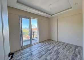 Квартира планировки 1+1 в районе Финике - Анталия 