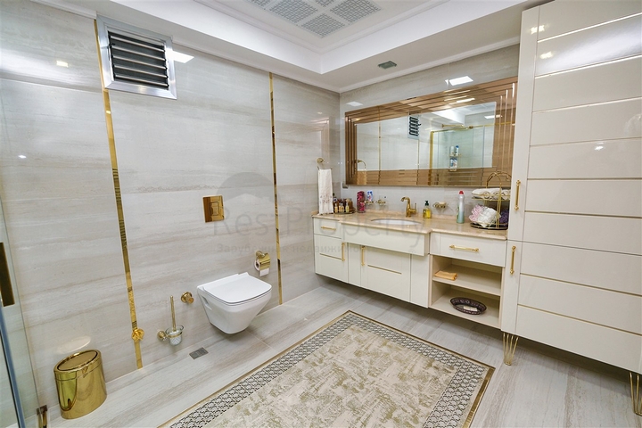 Квартира планировки 3+1 в районе Ешилбахче города Анталия 