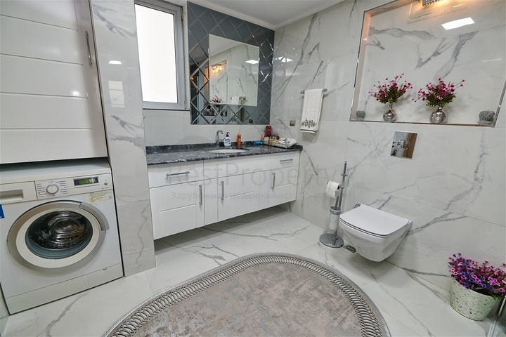 Квартира планировки 3+1 в районе Ешилбахче города Анталия 