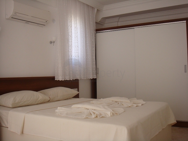 Апартаменты с 2 спальнями  в уютном комплексе в Фетхие.