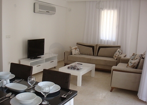 Апартаменты с 2 спальнями  в уютном комплексе в Фетхие.