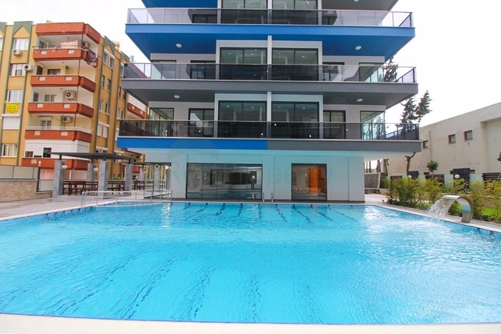 Квартира 1+1 на первой линии в Махмутлар