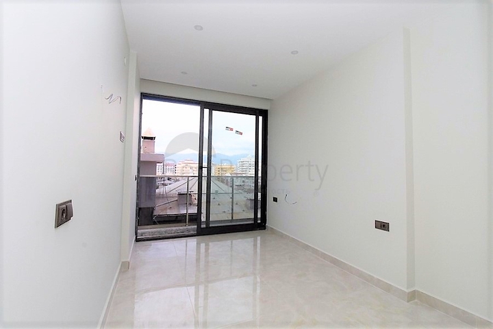 Квартира 1+1 на первой линии в Махмутлар