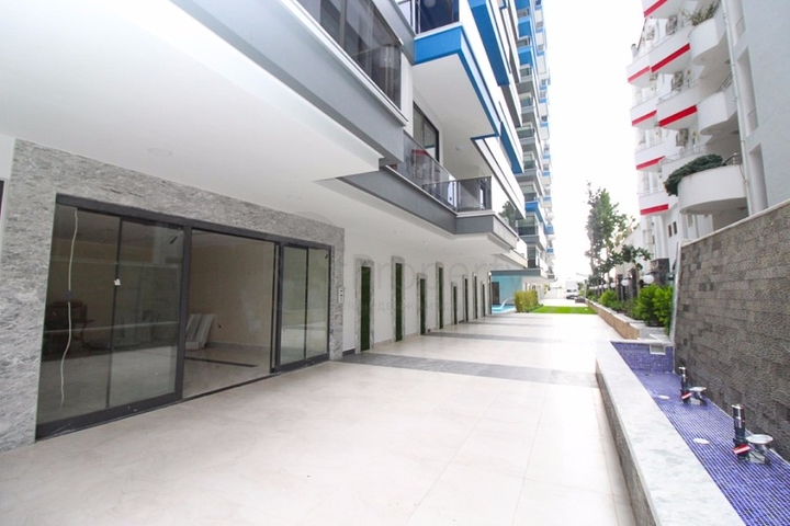 Квартира 1+1 на первой линии в Махмутлар