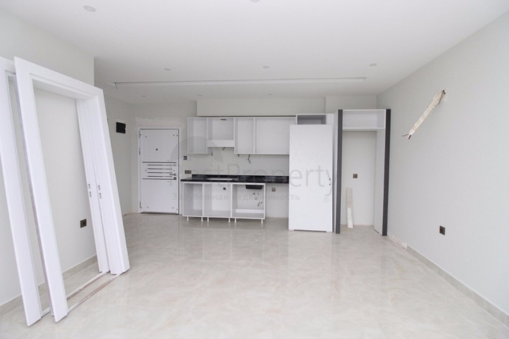 Квартира 1+1 на первой линии в Махмутлар